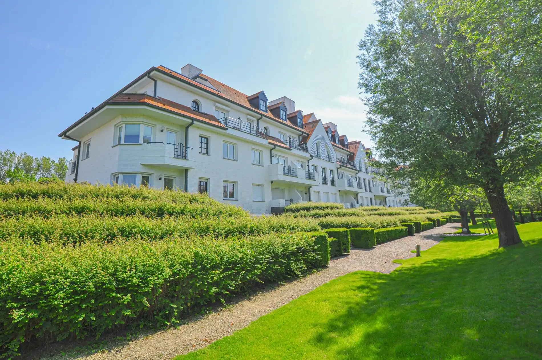 Subliem hoekappartement met ruime terrassen gelegen in het prestigieuze domein Tennis Garden. foto 11