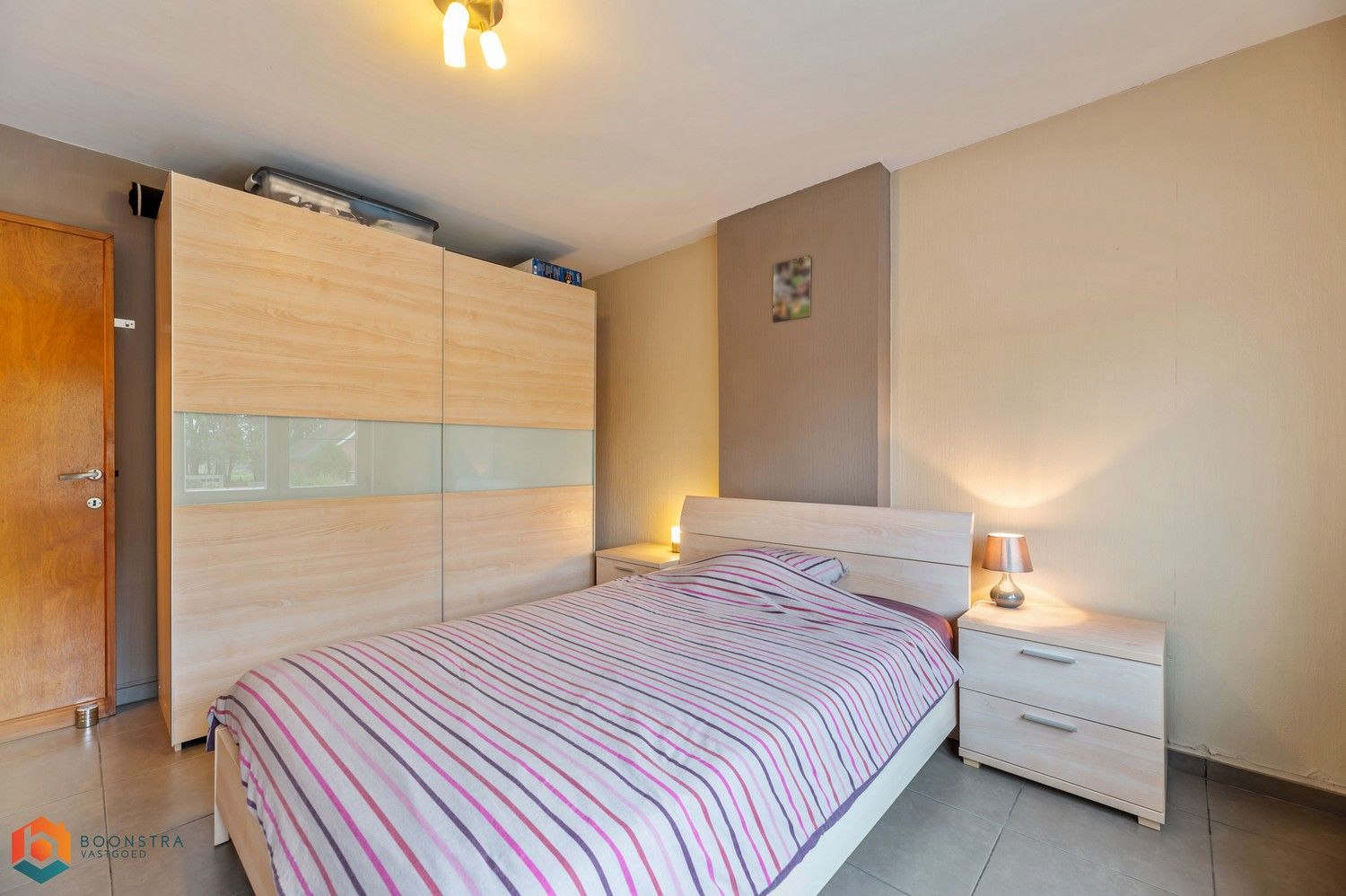 Verzorgde woning met 2 slpkrs, leuke tuin en garage foto 16