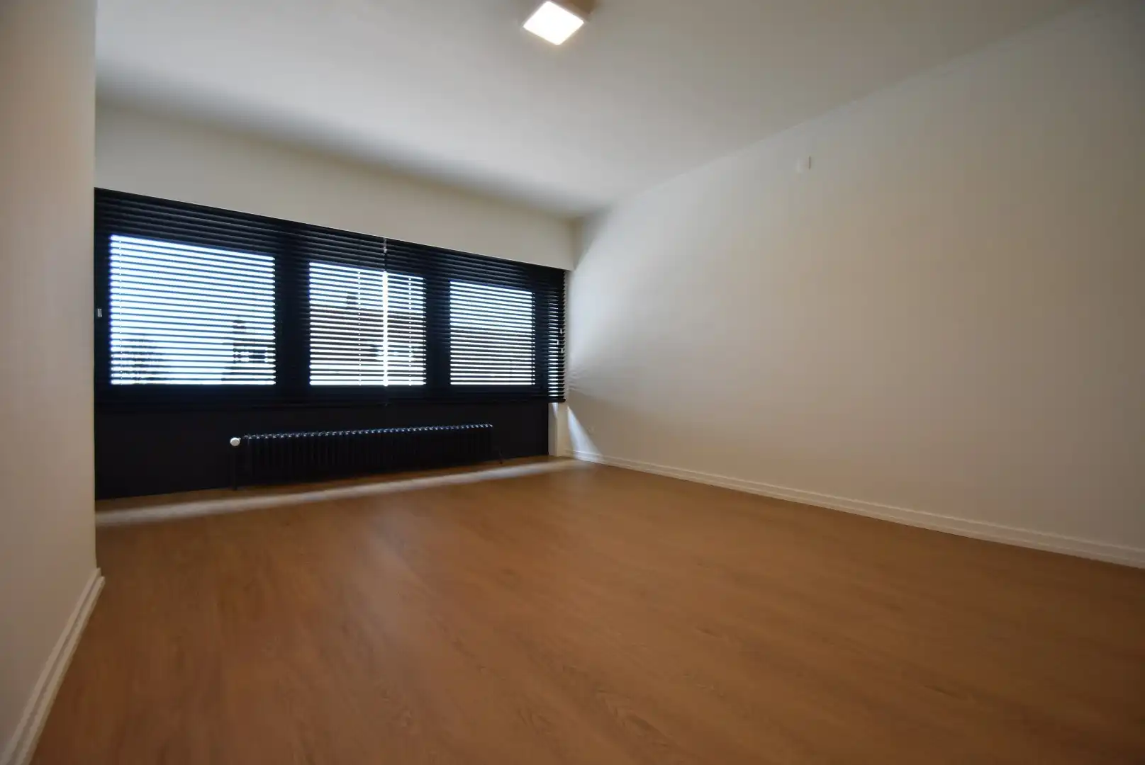 Knappe rijwoning met inpandige garage en mooie tuin in het centrum van Riemst foto 16