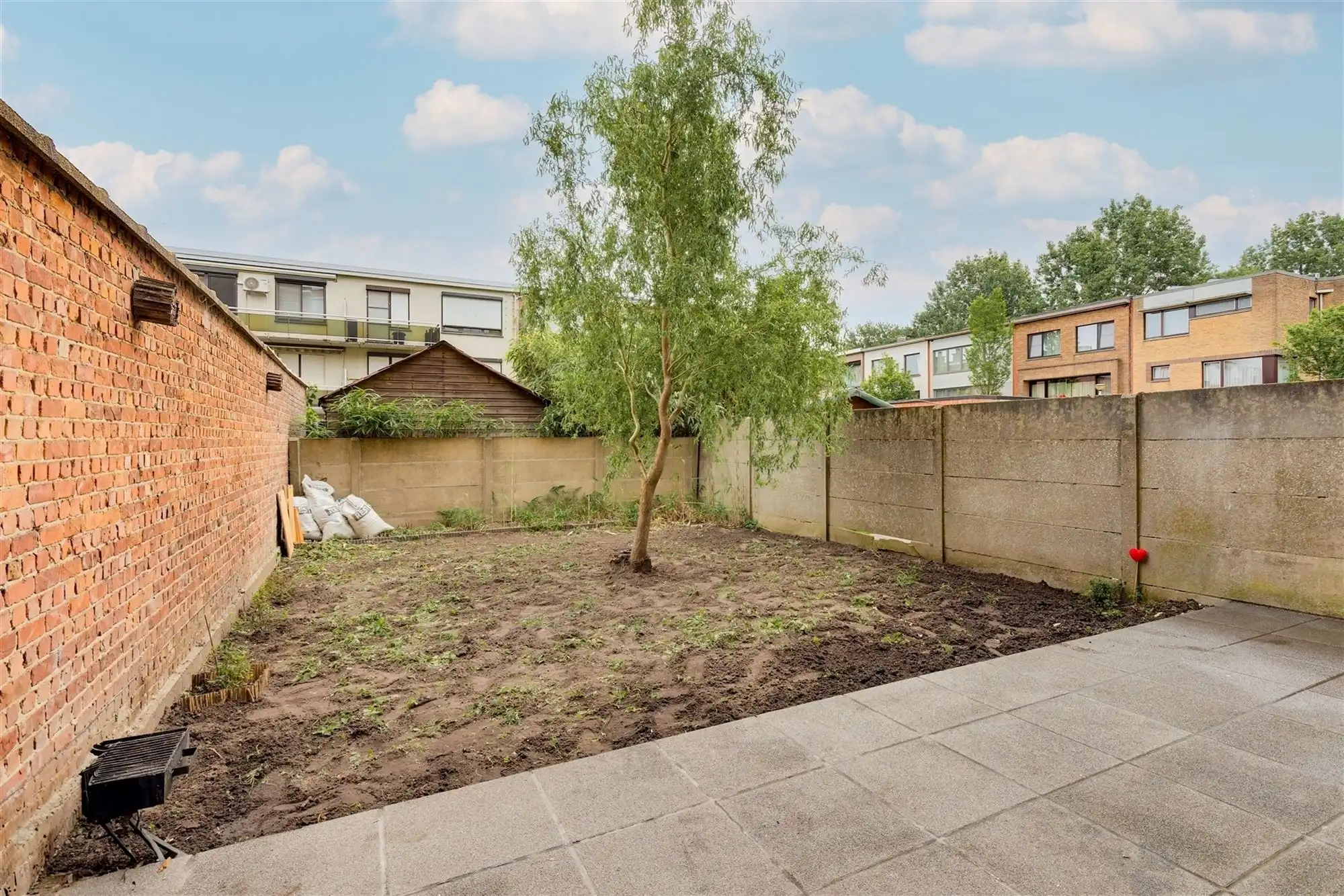 Lichtrijk 1-slaapkamer appartement met tuin en garagebox te koop in Merksem foto {{pictureIndex}}