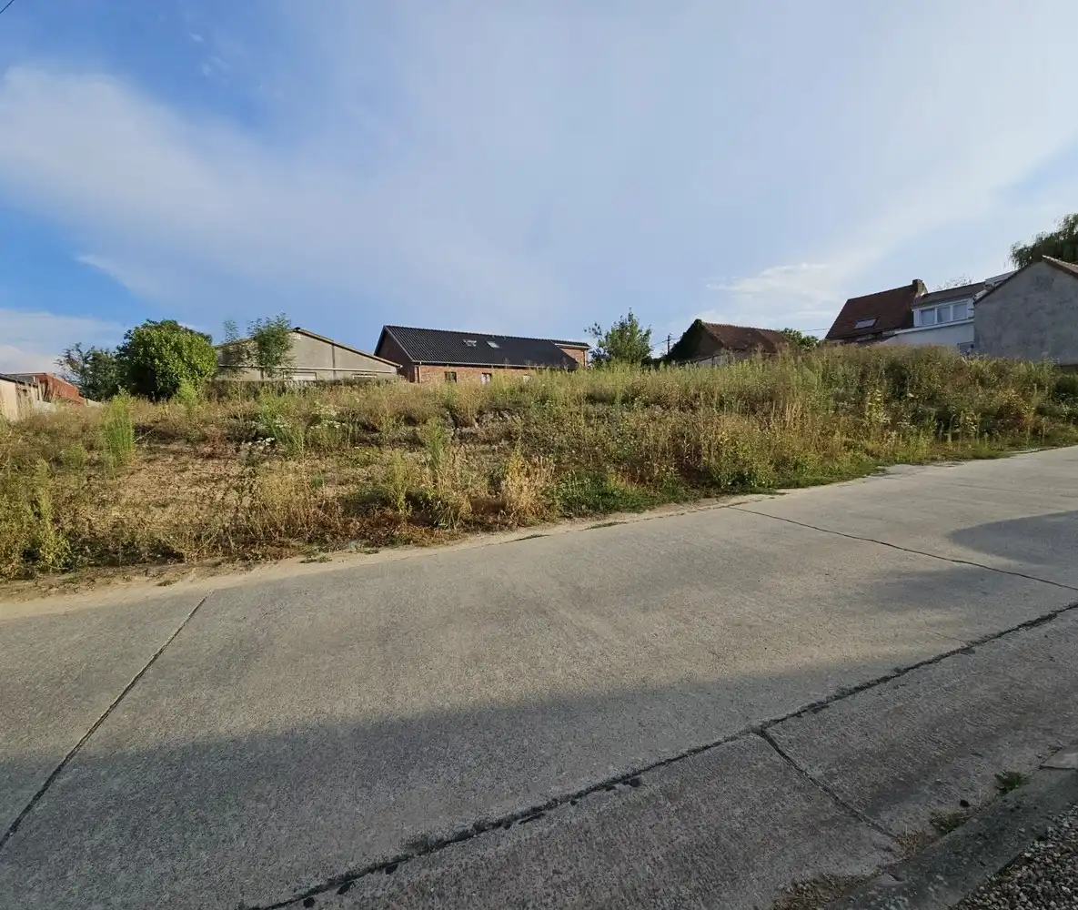 Landelijk gelegen bouwgrond voor open bebouwing foto {{pictureIndex}}