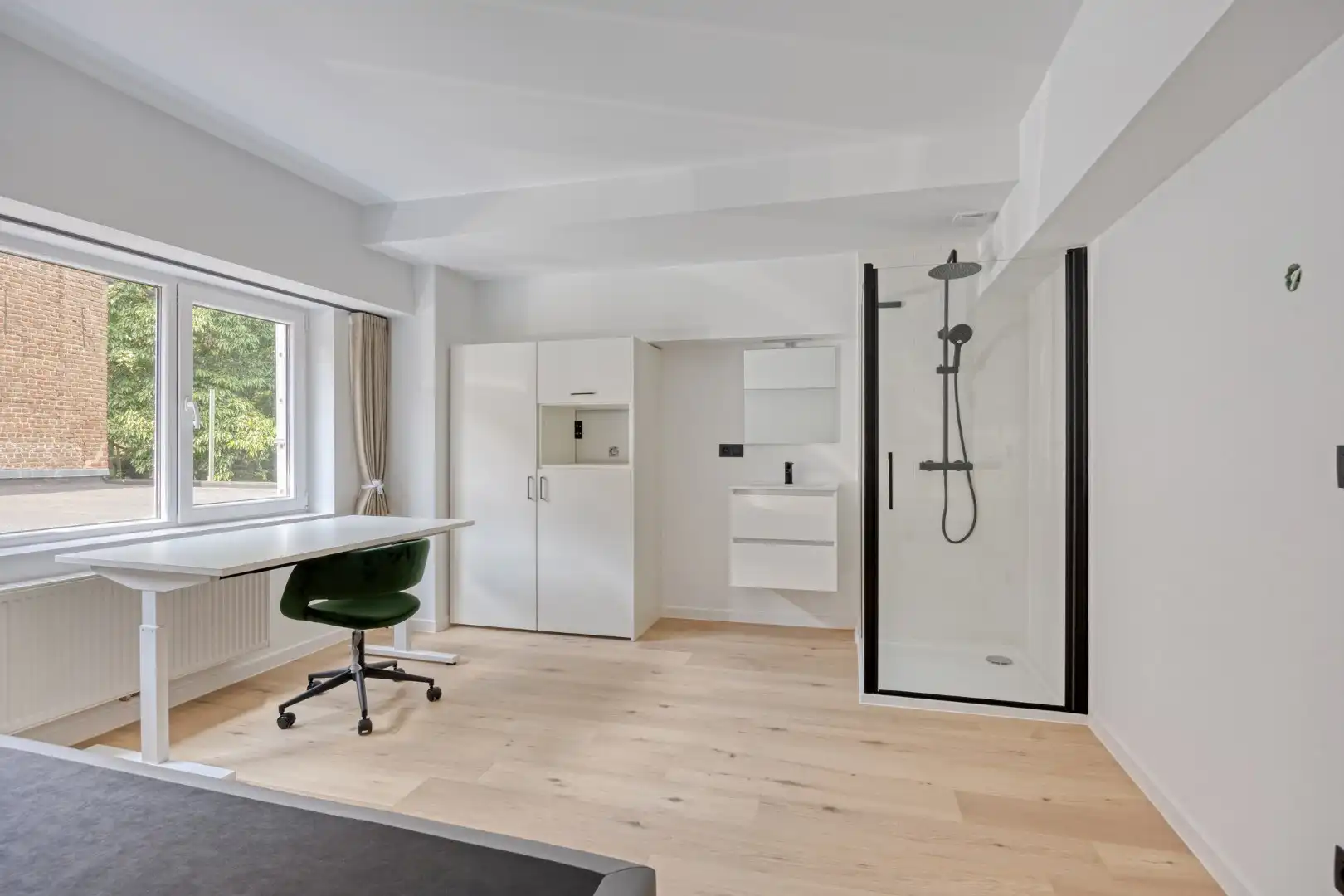 Volledig gerenoveerde studentenkamer in residentie met 15 studentenkamers en een 1slaapkamer appartement in hartje Leuven - EPC label A! foto {{pictureIndex}}