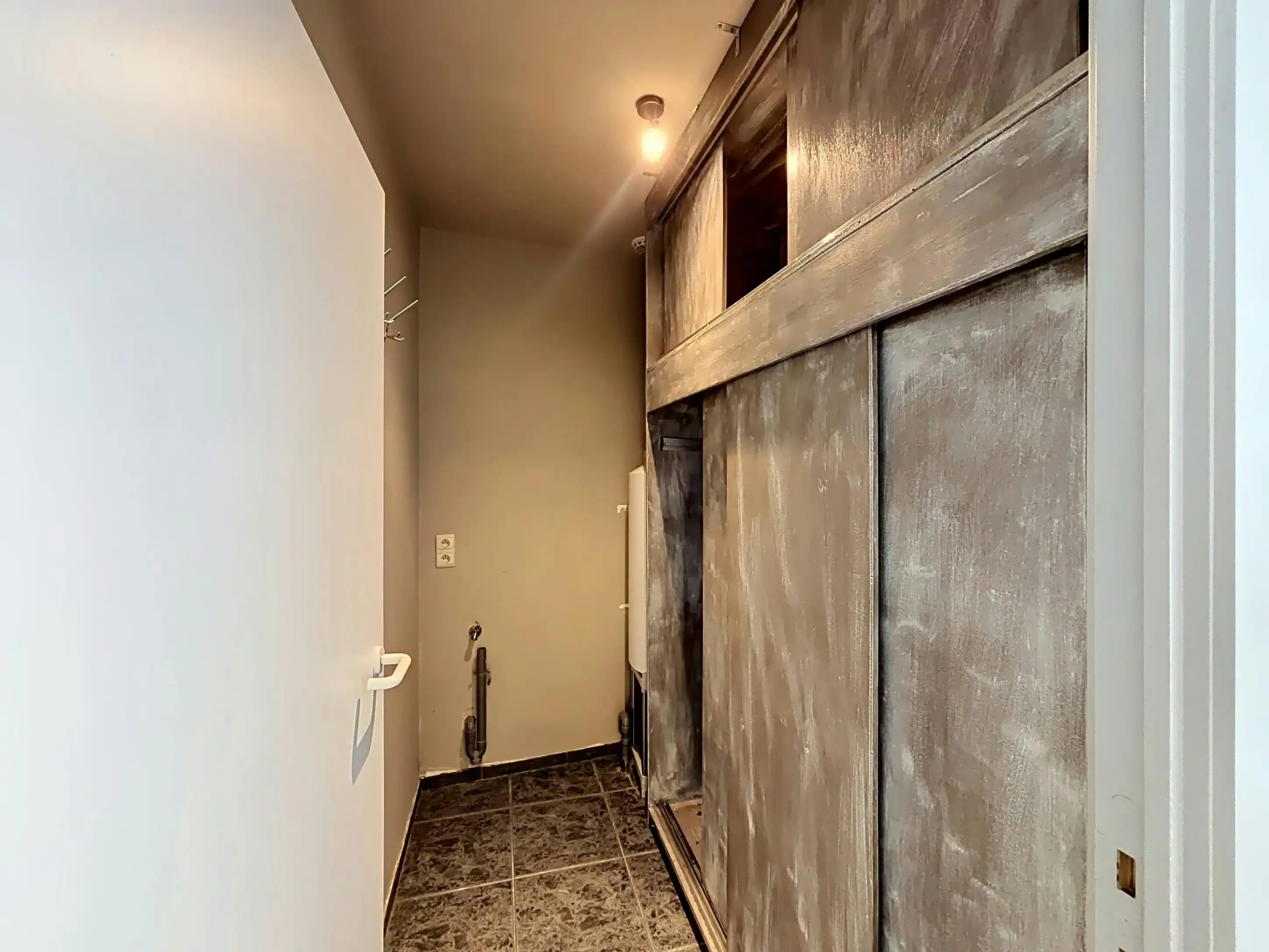 Instapklaar gelijkvloers appartement met gemeenschappelijke tuin en fietsenberging in hartje Kapellen! foto 14