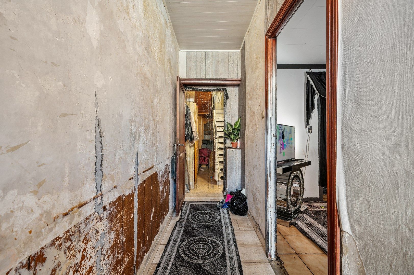 Te renoveren rijwoning met potentieel in de buitenrand van Tienen foto 4