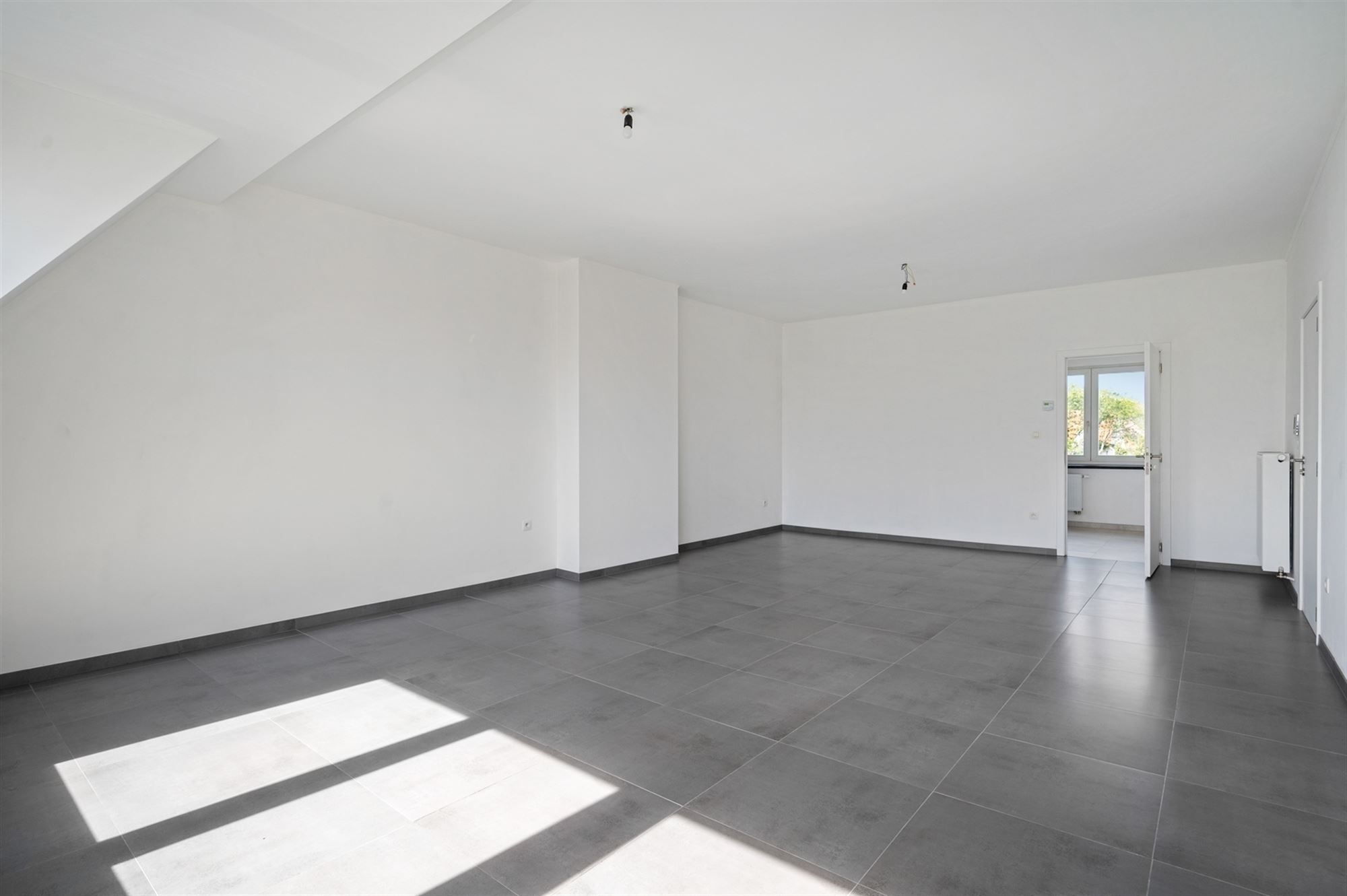Gerenoveerd en lichtrijk appartement te Mechelen foto 3