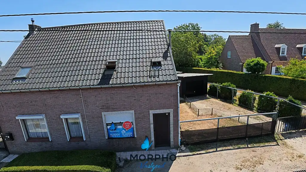 Hoofdfoto van de publicatie: Te renoveren halfopen woning of nieuwbouwmogelijkheid op 1.332 m² in Lievegem, Waarschoot