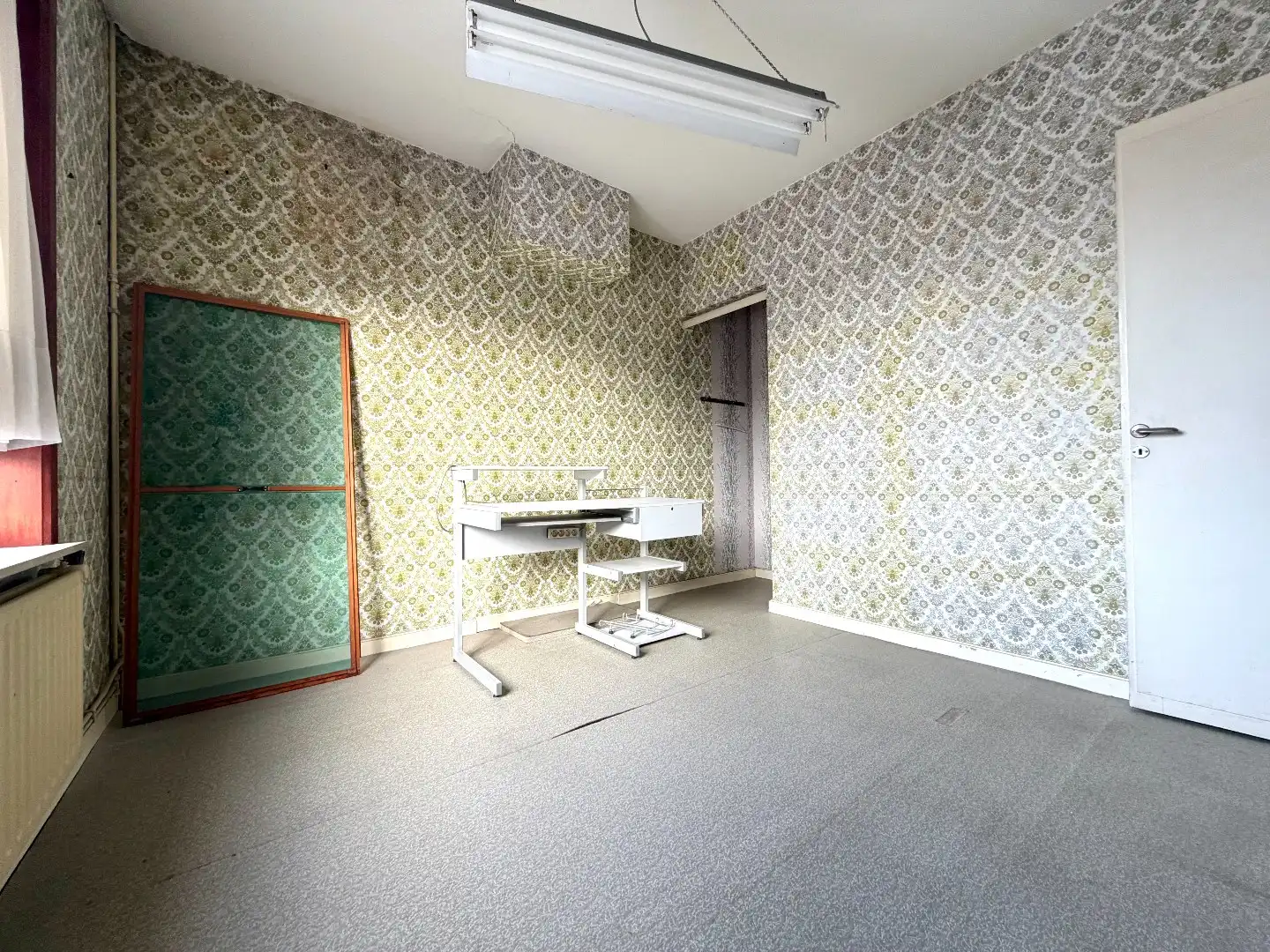 Te renoveren rijwoning met 4 slaapkamers en tuin in Kortrijk foto 10