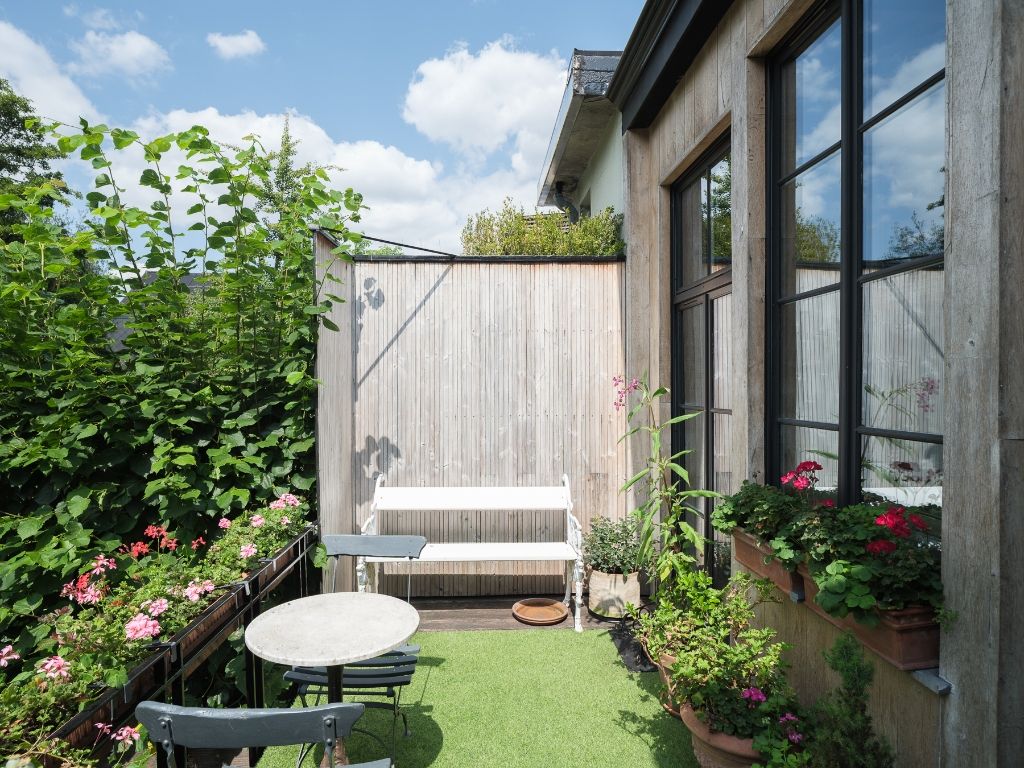 Karaktervolle burgerwoning met drie slaapkamers en een aangename, groene tuin op een uitstekende locatie in Gent. foto 7