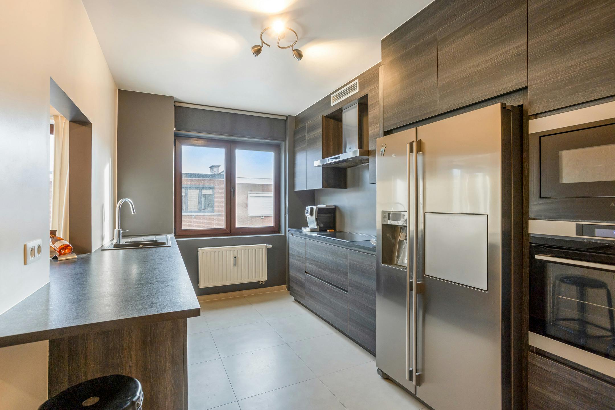 Totaal gerenoveerd appartement met 2 slaapkamers, terras en privé garagebox te centrum Strombeek foto 8