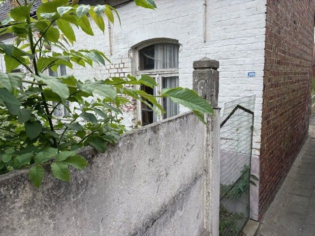 Volledig te renoveren huisje met mooi stuk tuin op een totale oppervlakte van 291m². foto 3