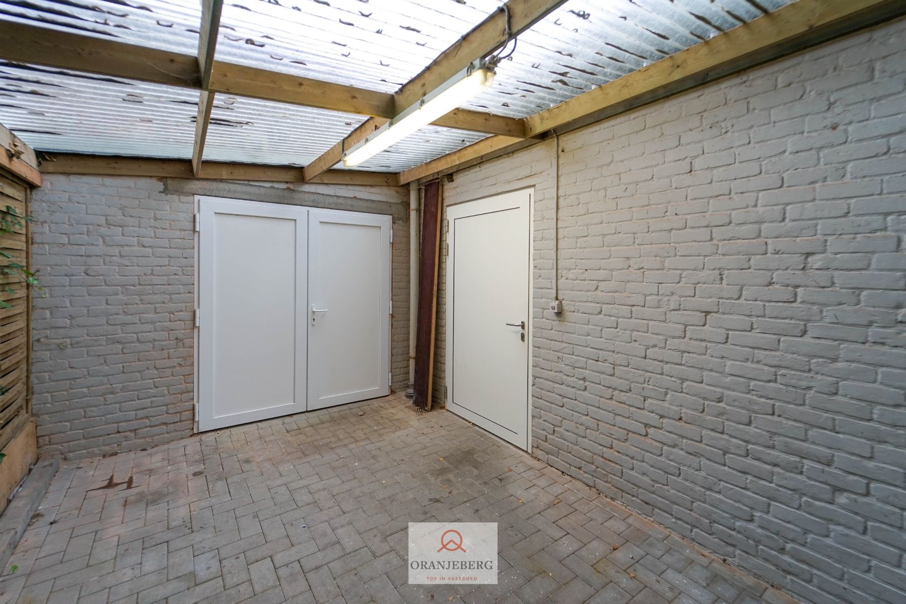 Ruim handelspand met meerdere ruimtes en parking te huur in centrum Drongen foto 15