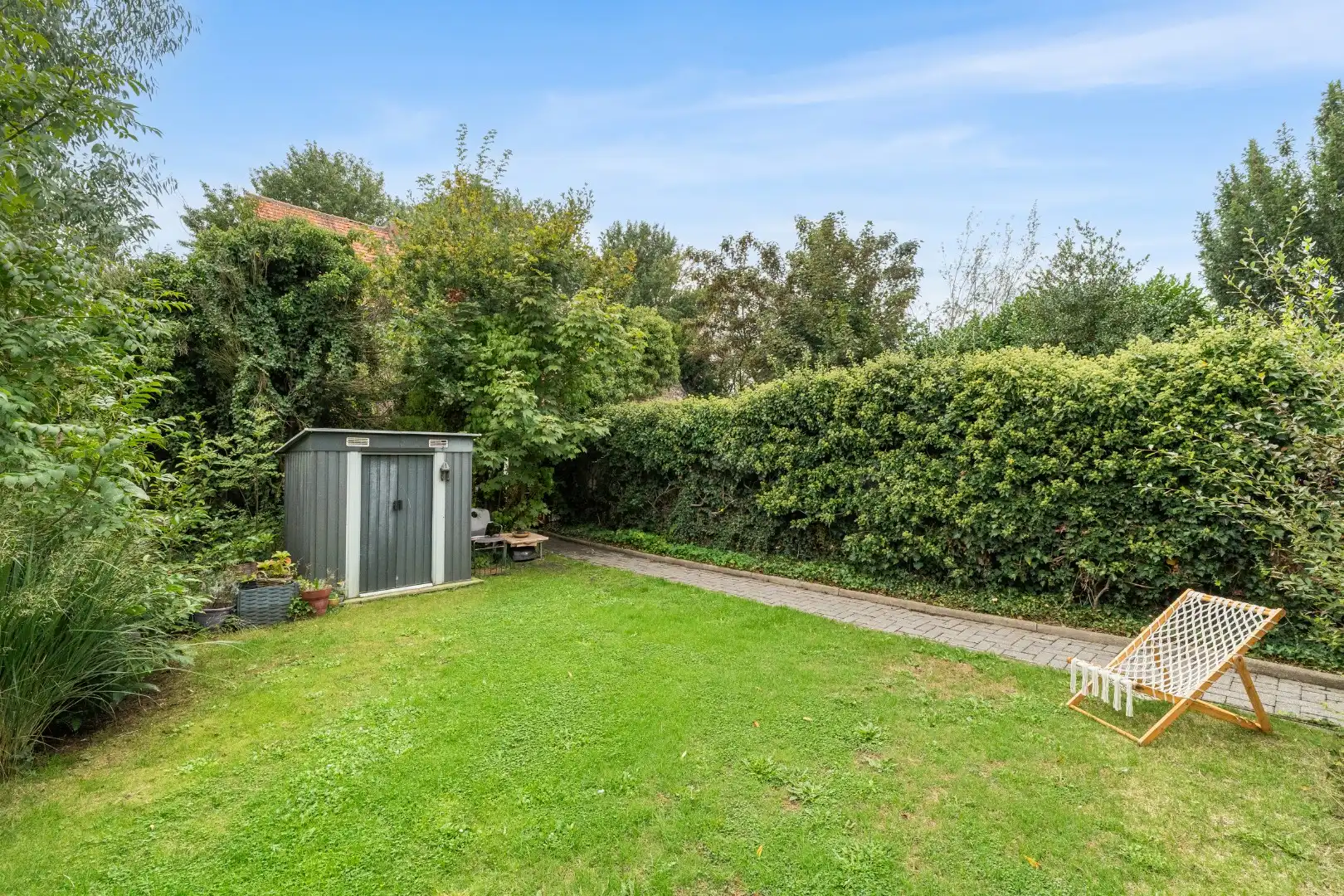 Te renoveren woning met ruime tuin nabij het centrum van Zomergem foto 21