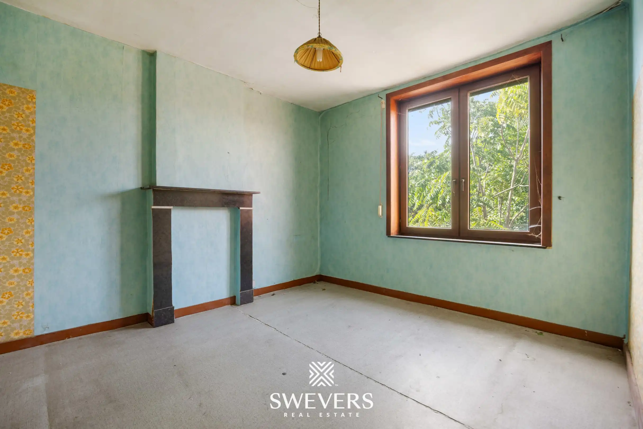 Renovatieproject met veel potentieel: karaktervolle rijwoning met tuin in de Banneuxwijk foto 13