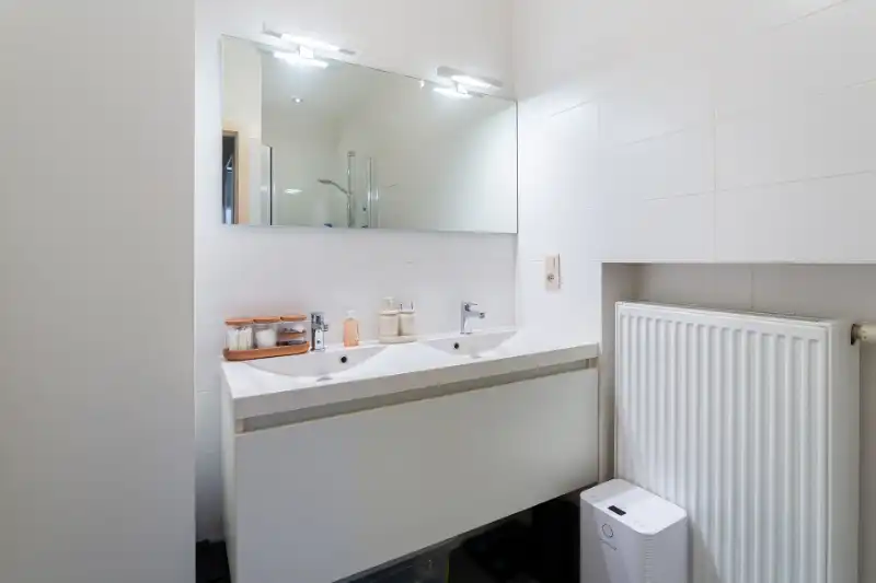 Gelijkvloers 2 slp. appartement met tuin en garage in hartje Brasschaat! foto 16