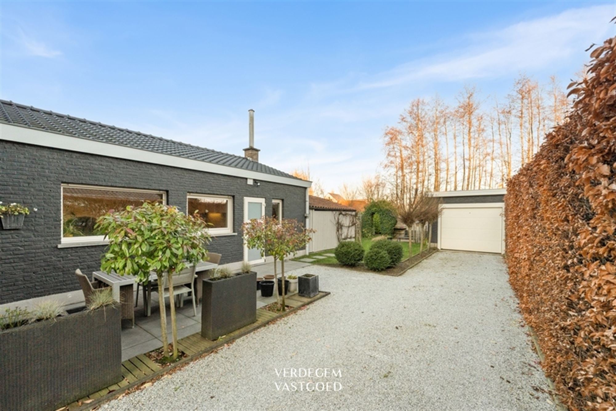 Stijlvolle en instapklare woning met 2+1 slaapkamers, garage en mooie tuin foto 18