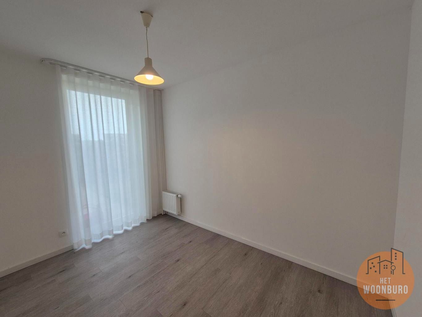 Gelijkvloersappartement met tuin, kelder en parkeerplaats foto 8