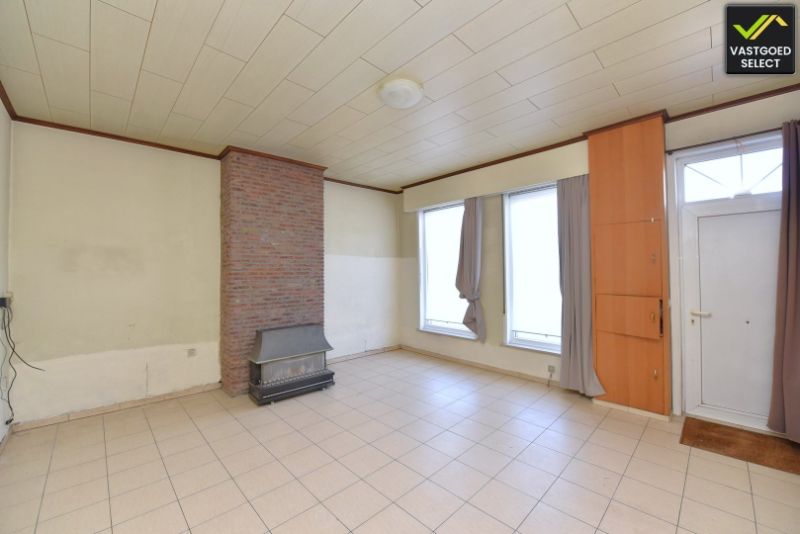 Vastgoed Select: Halfopen bebouwing met zonnige tuin, garage en renovatiepotentieel in Eeklo foto 4