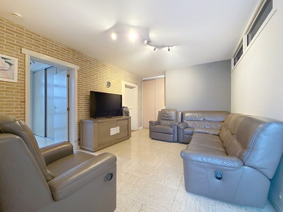 Centraal gelegen gelijkvloers appartement met tuin en garage foto 4