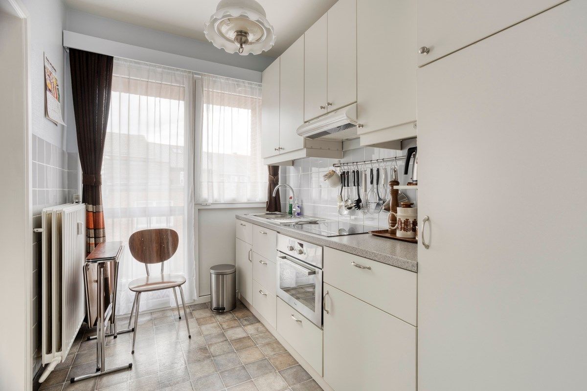 Opbrengsteigendom met 3 appartementen, garages en tuin foto 22