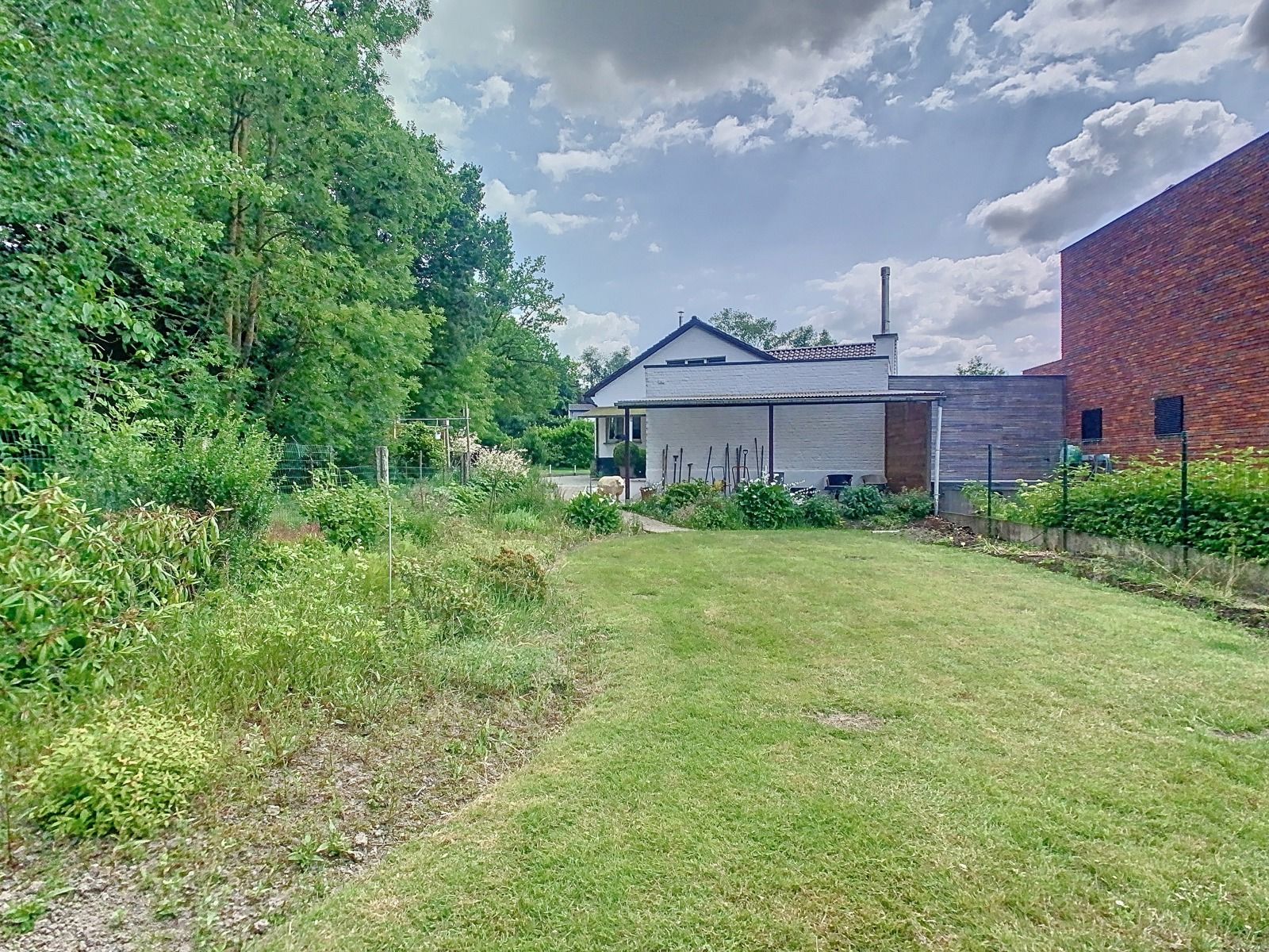 Charmante woning met 2 SLPK, dubbele grage en riante tuin! foto 21