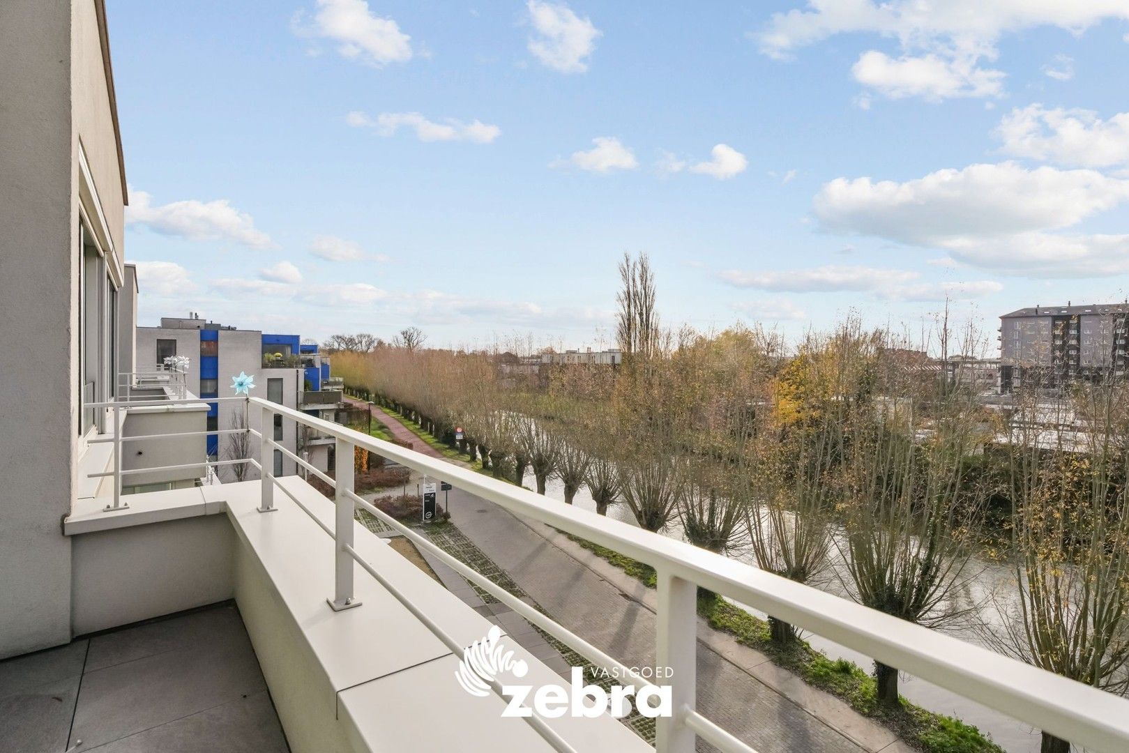 Moderne serviceflat met prachtig zicht op de Leie en autostaanplaats te Deinze! foto 16