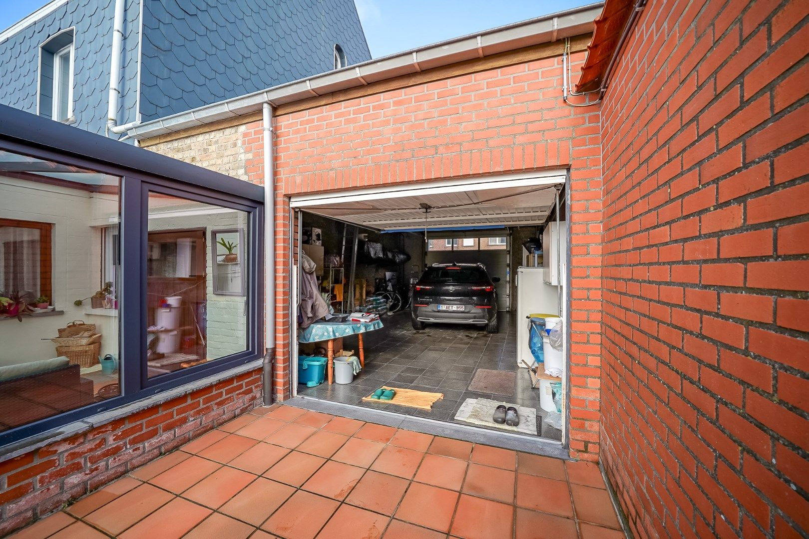 TE KOOP  instapklare woning met grote zonnige tuin en garage/loods. foto 11