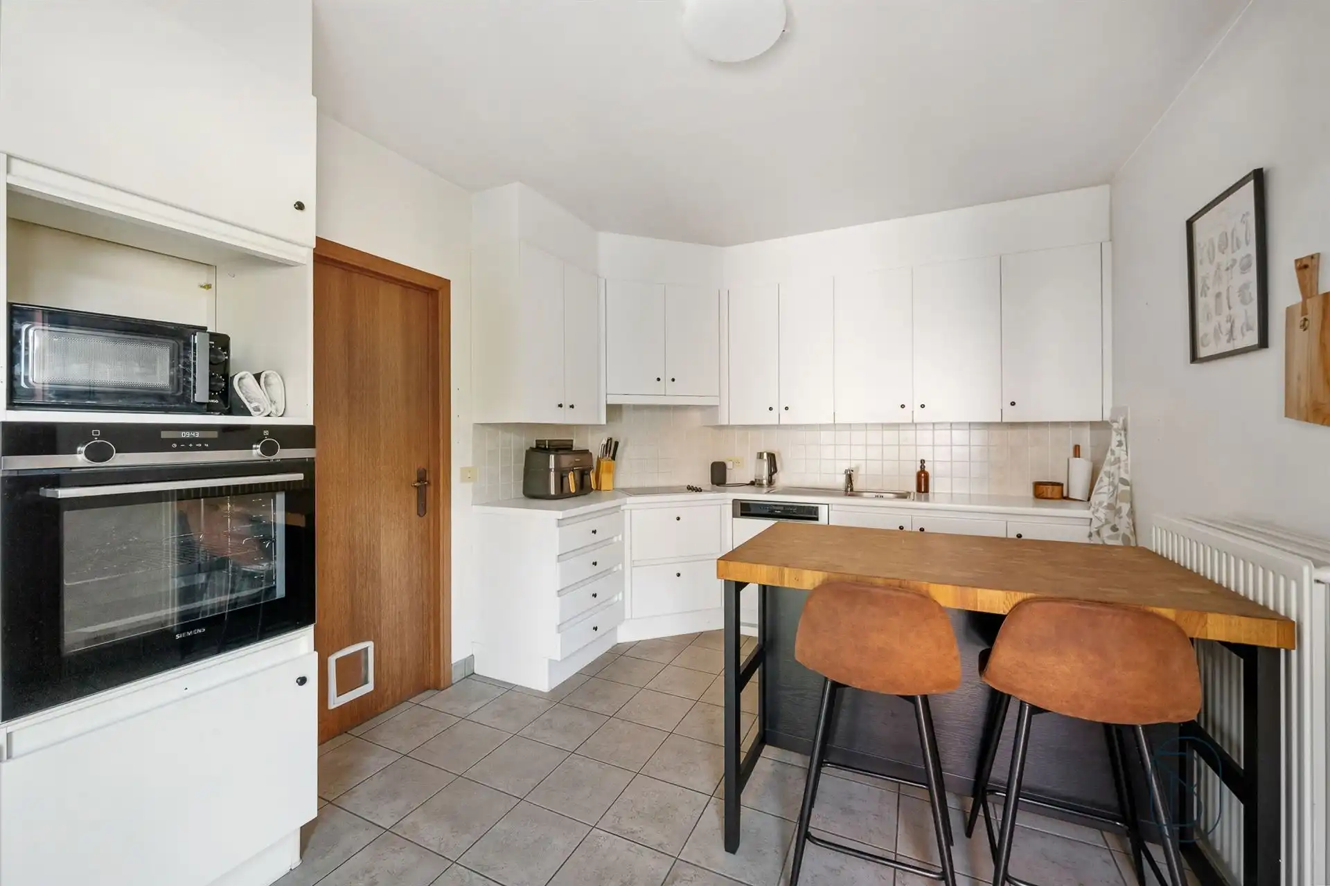 Instapklare woning met grote aangename tuin.  foto 9
