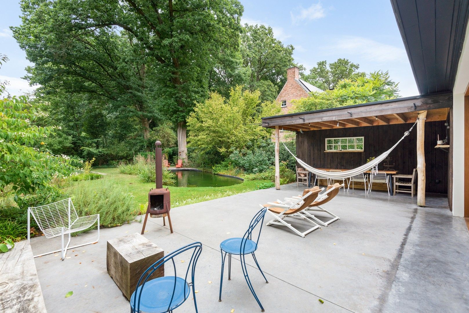 Stijlvolle, vrijstaande villa met zonnige tuin en zwemvijver foto 16