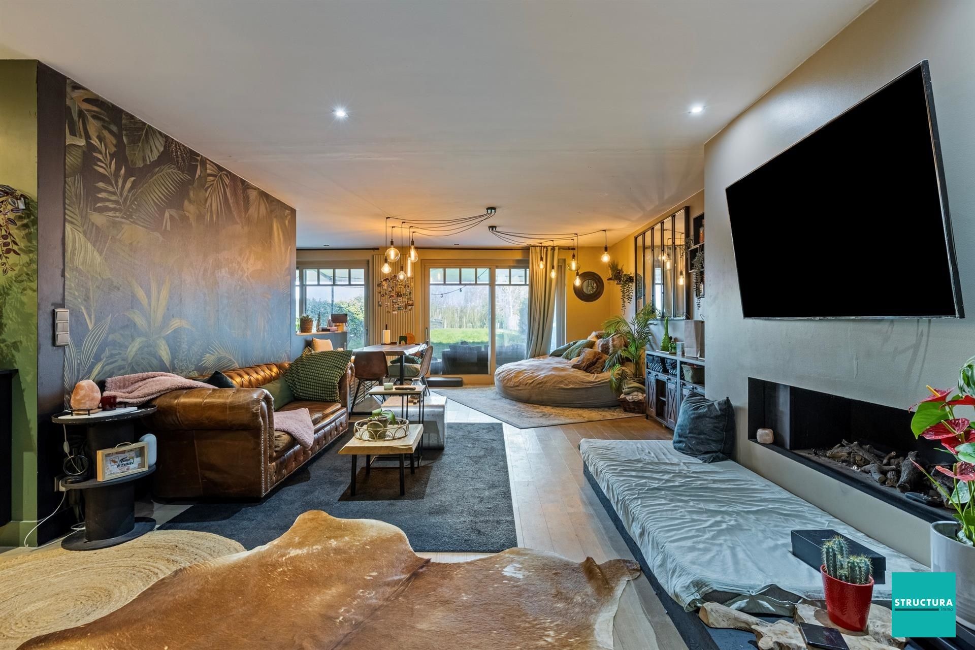 Gelijkvloers appartement met ruime tuin en twee carports foto 5