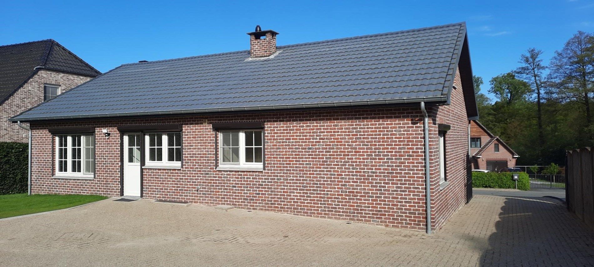 Gelijkvloerse gezinswoning met 3 slaapkamers, fraaie tuin en carport in Opoeteren. foto 14