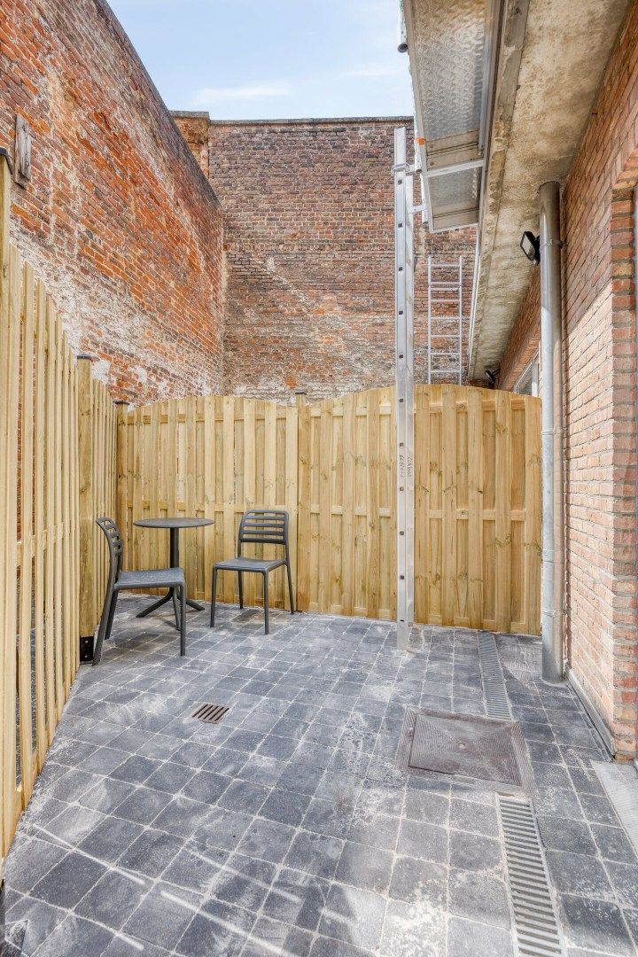Volledig gerenoveerde studentenkamer in residentie met 29 studentenkamers met eigen sanitair en terras in hartje Leuven - EPC label A! foto 3