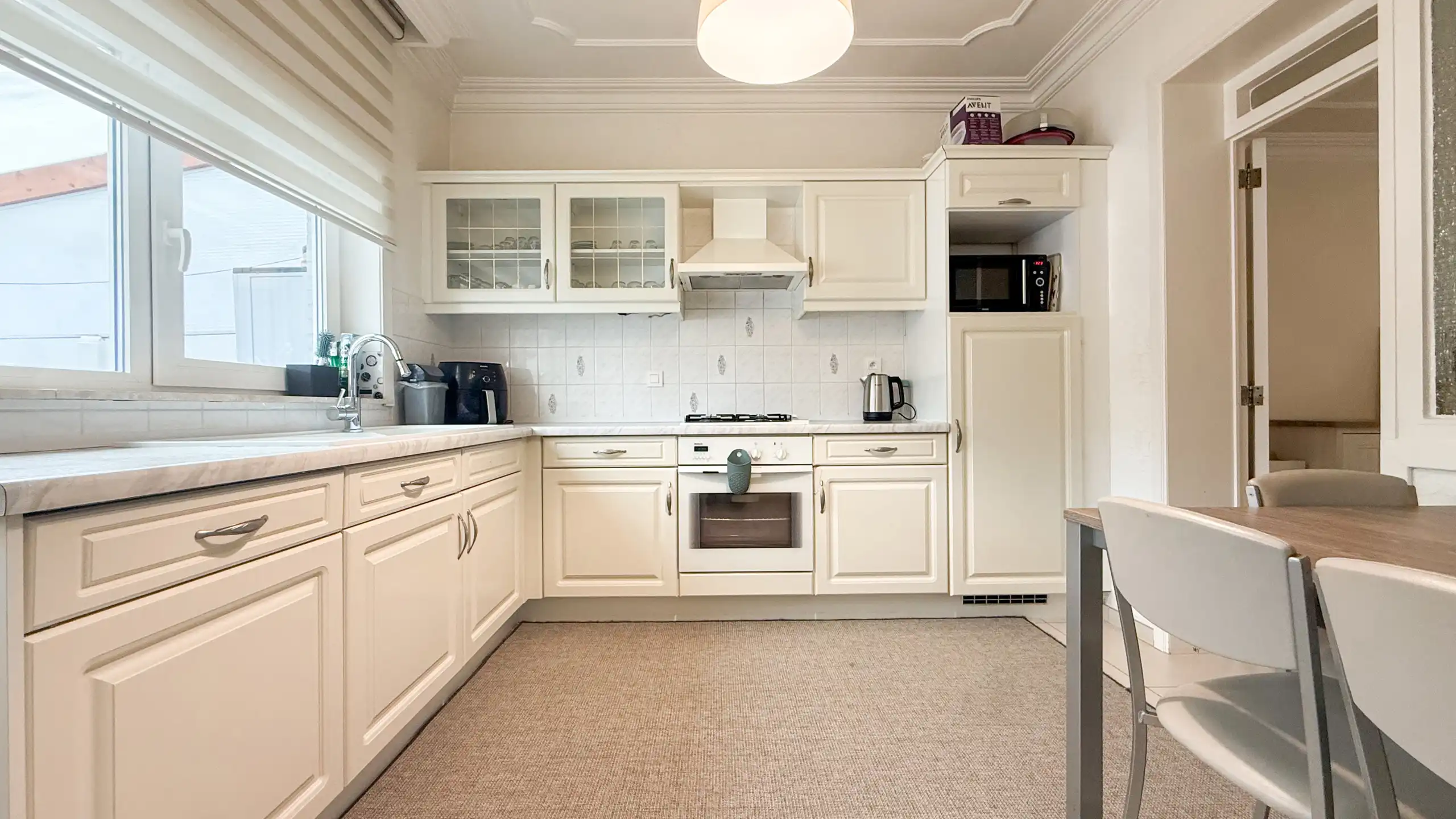 Gezinswoning met 4 slaapkamers centraal in Heusden! foto {{pictureIndex}}