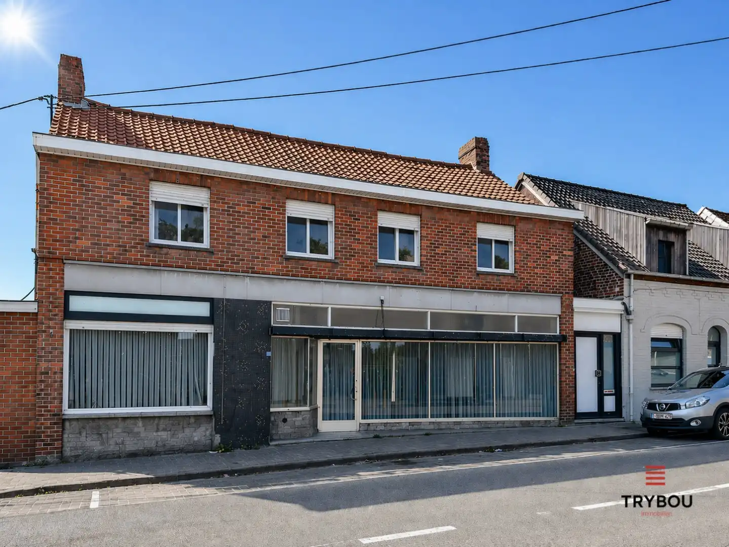Hoofdfoto van de publicatie: Ruime woning met winkelruimte, loods (optioneel) en garage 
