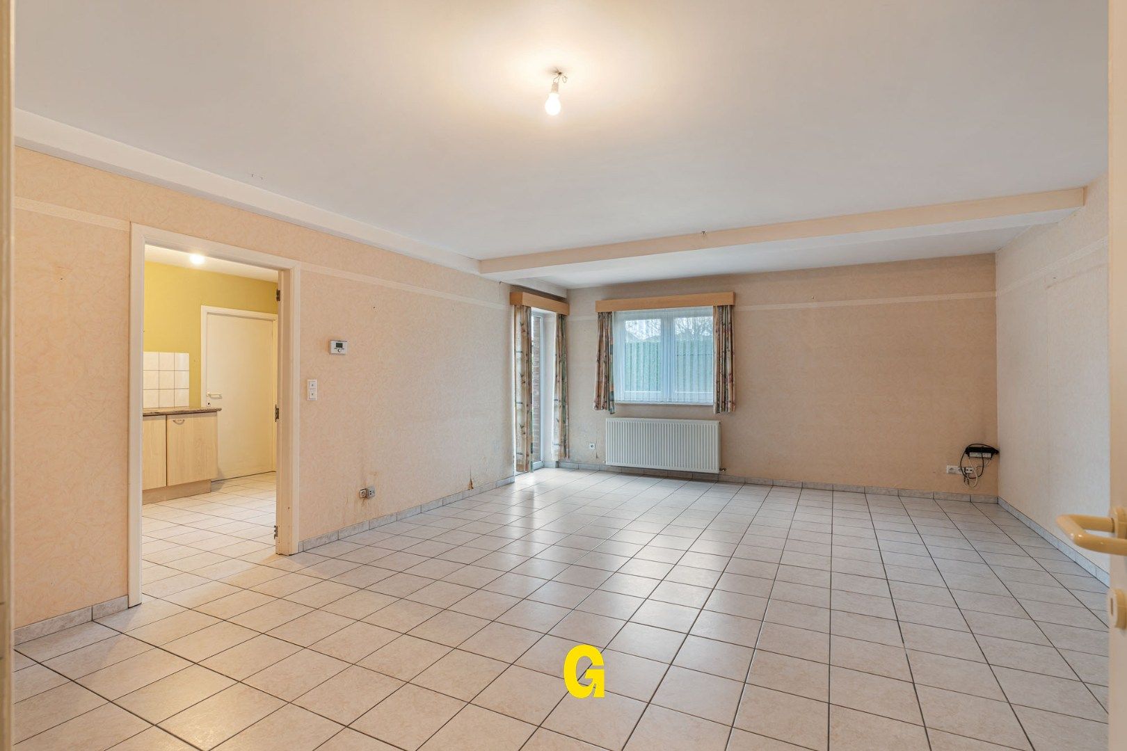 Degelijk (rolstoelvriendelijk) gelijkvoersappartement met terras uitgevend op de tuin, afsluitbare garage en berging foto 6