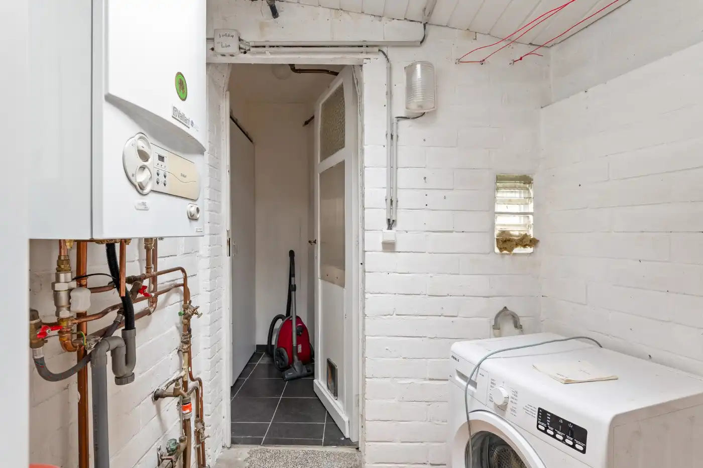 Leuke starterswoning met 2 slpk., garage en gezellig west-tuintje foto 14