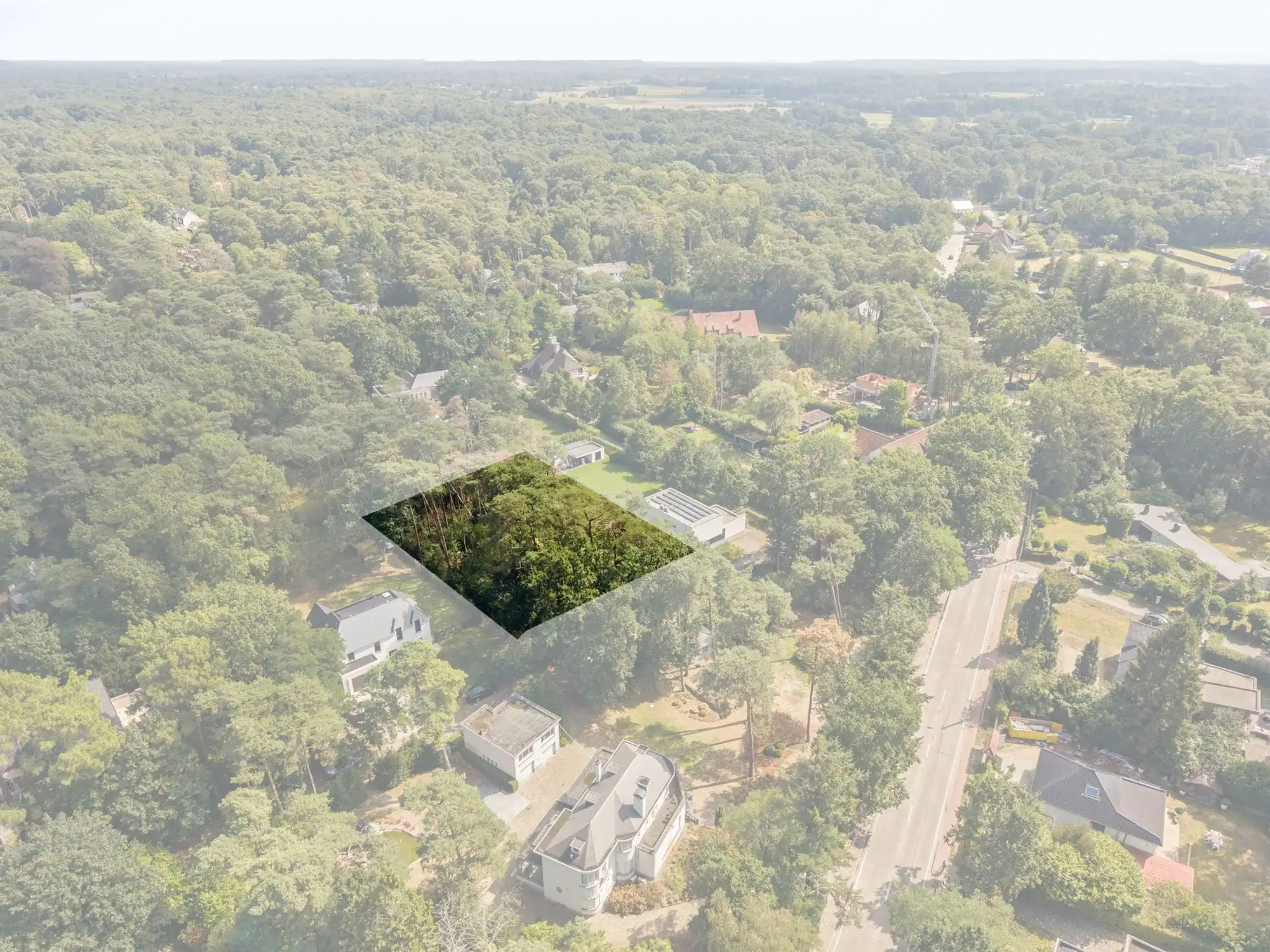 Bouwgrond van 1.555 m² in groene omgeving nabij het dorpshart foto 2