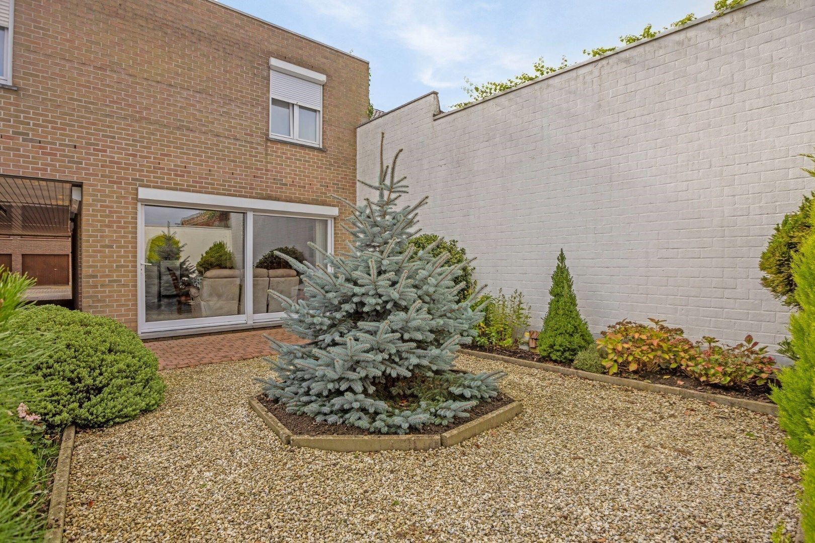 Heel aangenaam, lichtrijk gelijkvloers appartement met tuin én garage! foto 2