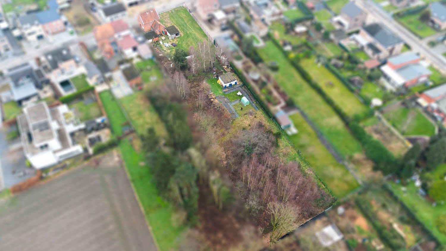 Te renoveren woning met veel mogelijkheden op een ruim perceel van 32a40ca te Lanaken! foto 11