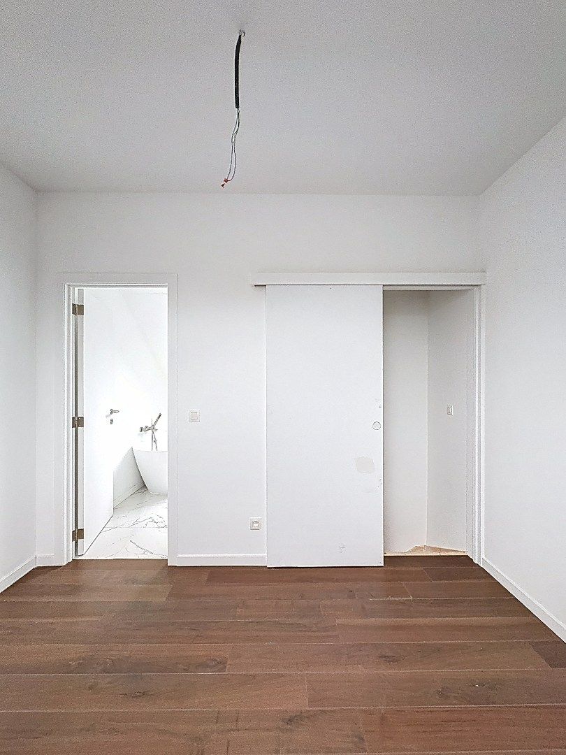 Elegant wonen in Tienen: gerenoveerde rijwoning met 3 slaapkamers en zuidwestgerichte tuin. foto 15