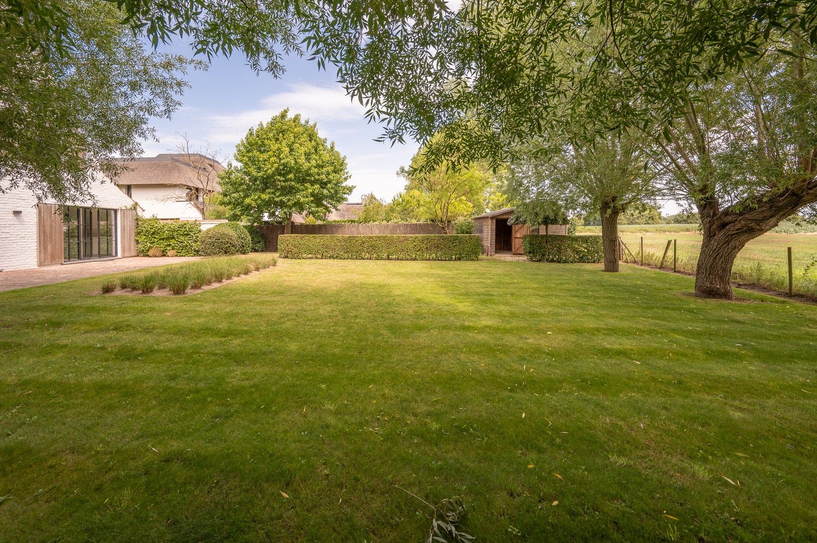 Alleenstaande villa genietend van prachtige open zichten op de polders. foto 12