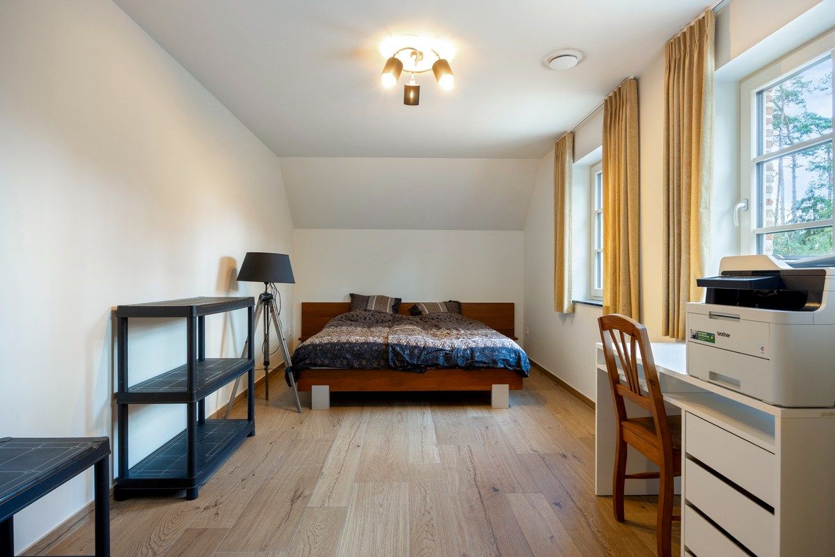 Ruim ingedeelde en kwalitatief afgewerkte villa op een mooi perceel met naastgelegen bouwgrond. foto 27