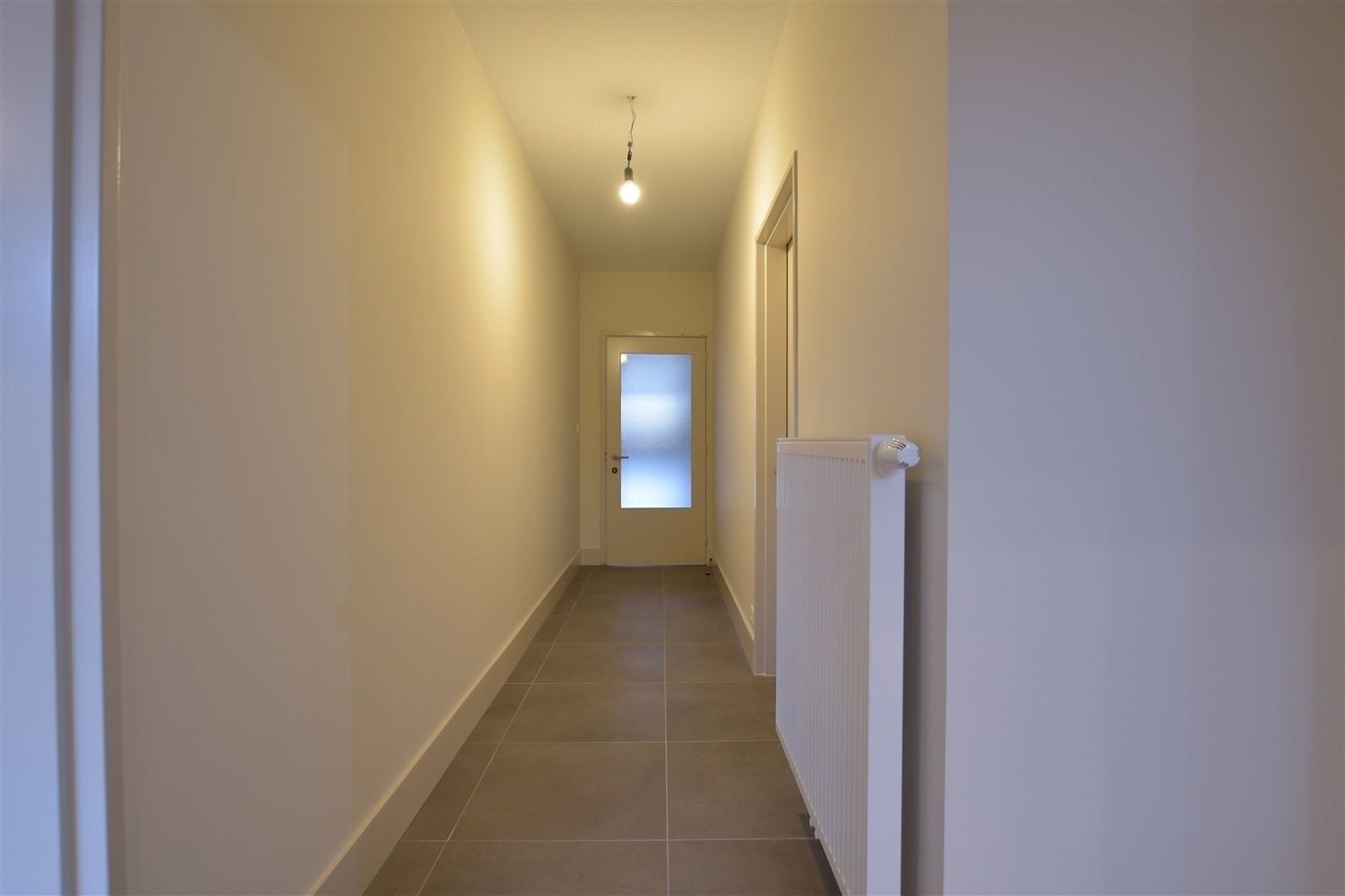 Totaal gerenoveerd GV appartement met tuin te Grembergen foto 24