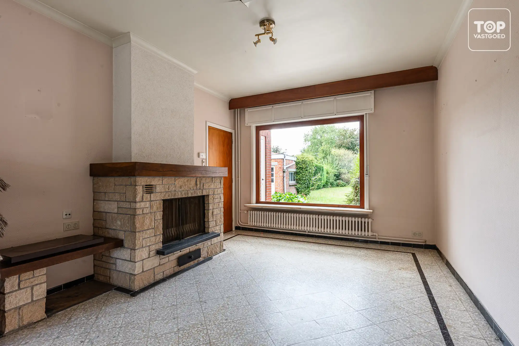 Te renoveren halfopen bebouwing met 3 slaapkamers, garage en ruime tuin op perceel van +-600 m² foto 6