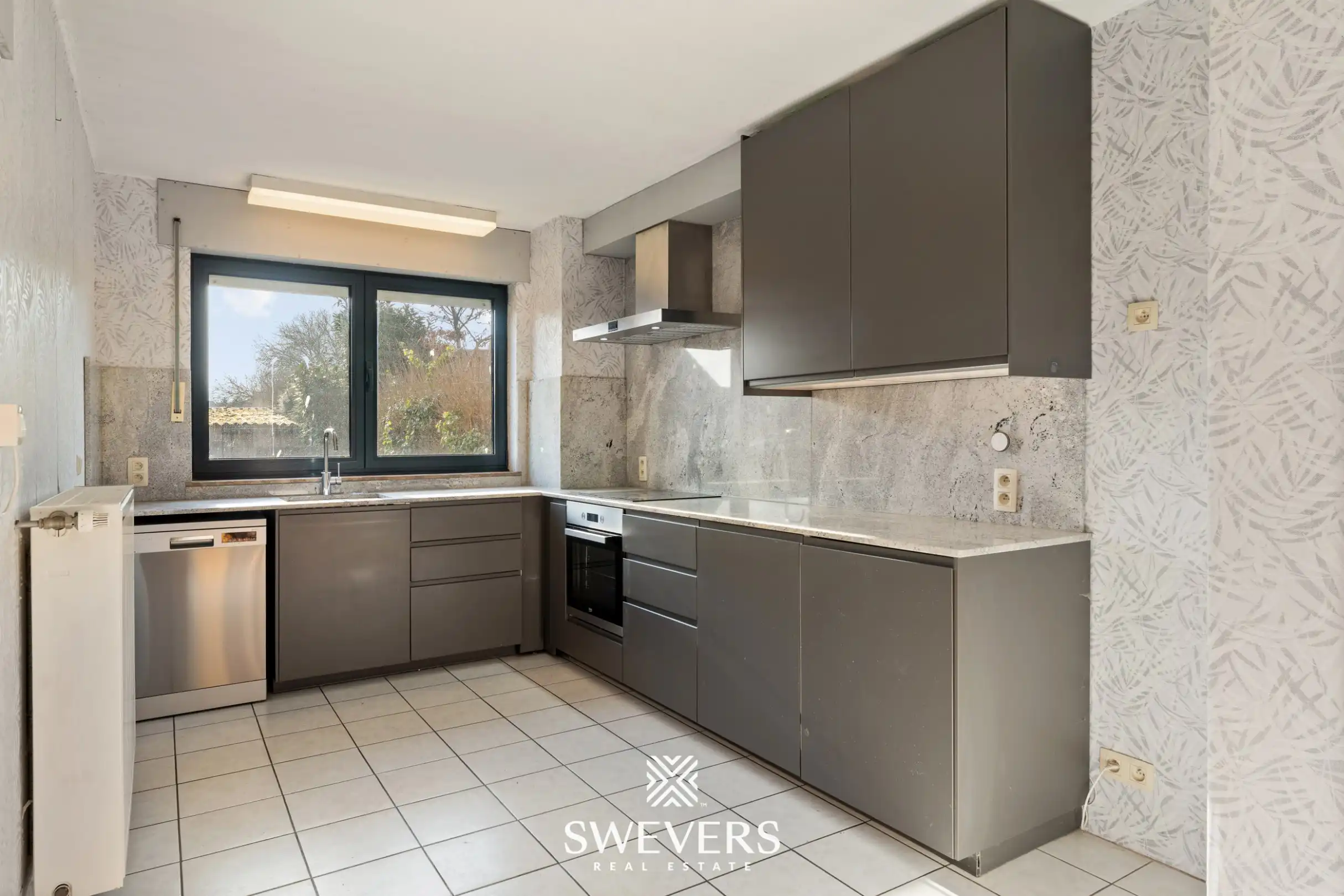 Verrassend ruime gezinswoning: 4 slaapkamers, garage, kelder & zolder   foto 11