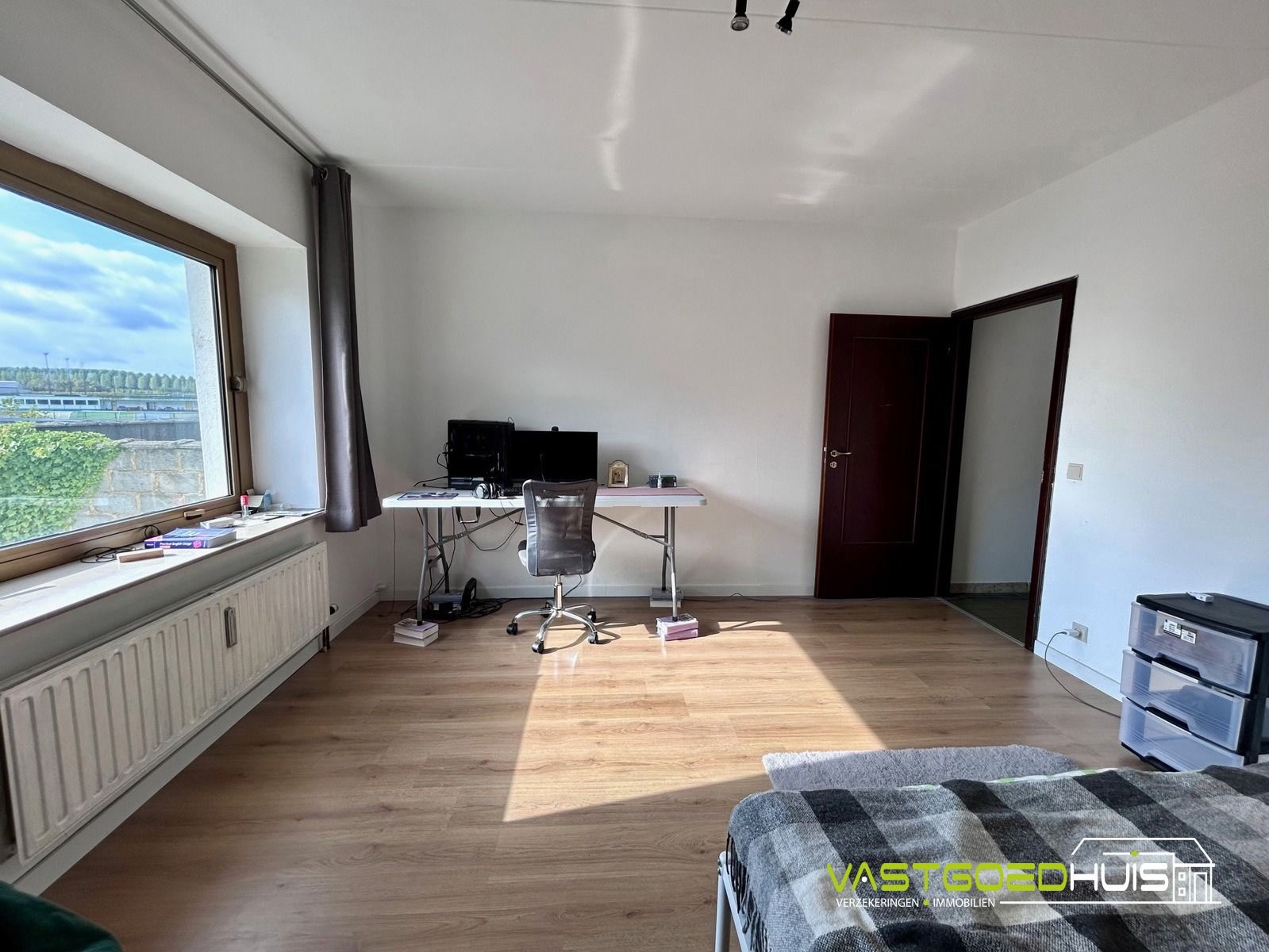 Ruim, gelijkvloers appartement met terras foto 14