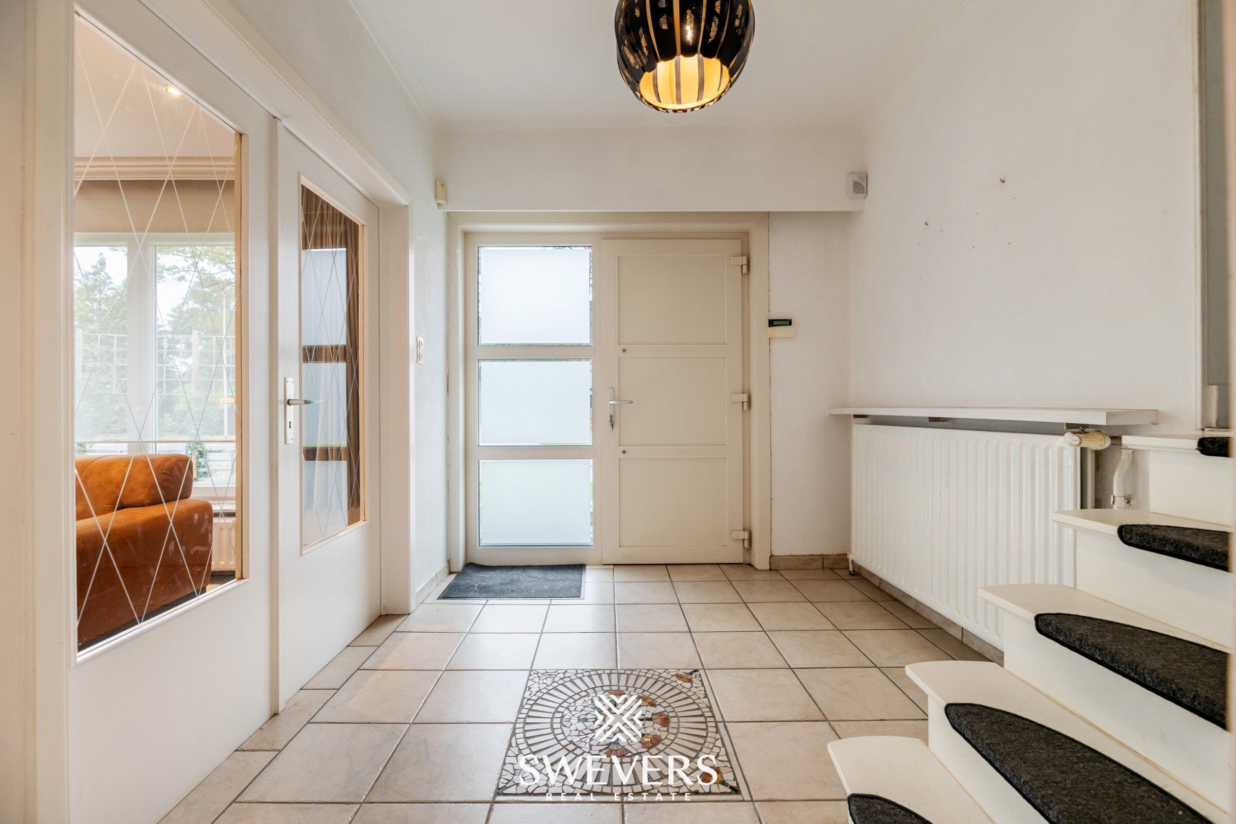 Instapklare gezinswoning met 3 slaapkamers, ruime kelder en zuidgerichte tuin in Beringen foto 3