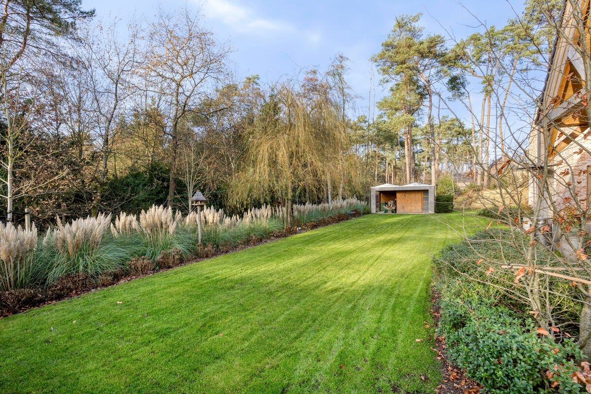 Ruim ingedeelde en kwalitatief afgewerkte villa op een mooi perceel met naastgelegen bouwgrond. foto 35