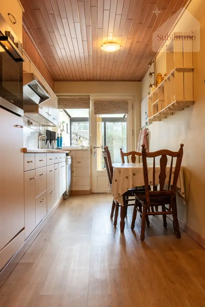 Opbrengsteigendom met 2 appartementen, tuin en garages te koop in Mol centrum foto 8