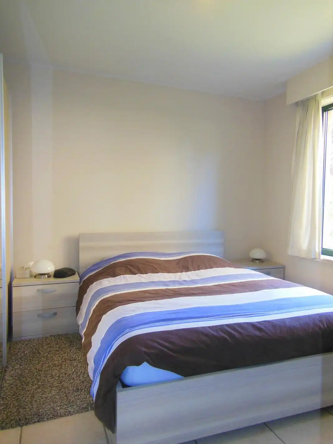 Gezellig gelijkvloersappartement met zonnige tuin en garage foto 8