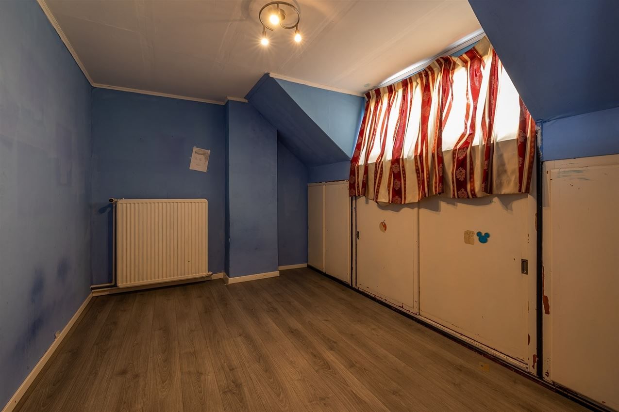 Ruime woning met zuidgerichte tuin en garage in rustige straat nabij centrum. EPC C en 5+ slaapkamers. foto 25